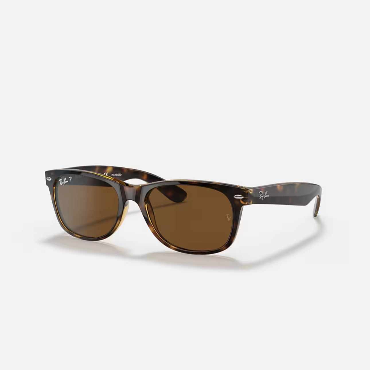Ray-Ban NEW WAYFARER CLASSIC
Sunglasses in Tortoise Frame and Brown Polarized lens
RB2132